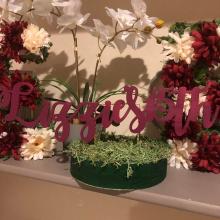 Lizzie's 15th sign in plant decoration