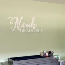 Noah Bradford two line name sign on wall
